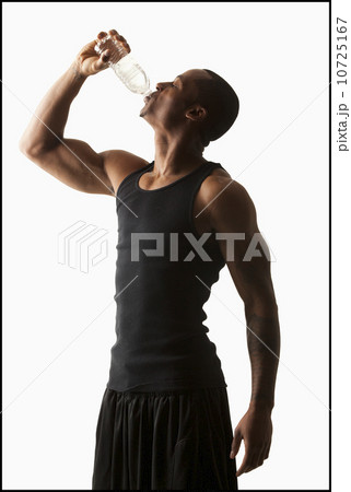 Studio shot of man drinking water from bottle 10725167