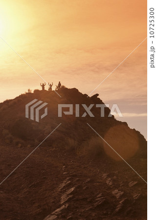 Mountain bikers on mountain peak 10725300