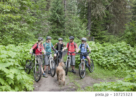 Canada, British Columbia, Fernie, Group of five people and dog enjoying mountain biking Canada, British Columbia, Fernie, Group of five people and dog enjoying mountain biking 10725323
