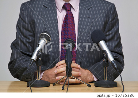 Man in front of microphones 10725336