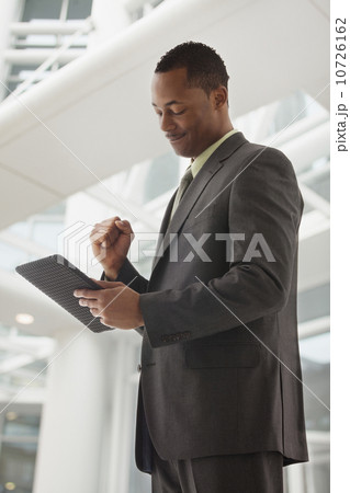 Content young businessman examining file 10726162