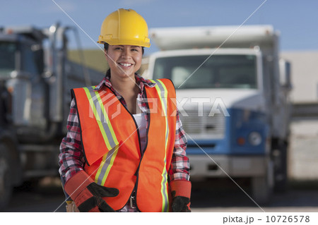Portrait of female construction worker on building site 10726578
