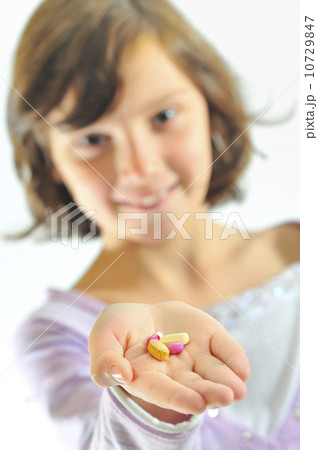 girl holding pills girl holding pills 10729847