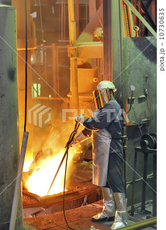 worker with hot steel worker with hot steel 10730635