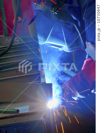 welder with protective mask welding metal and sparks welder with protective mask welding metal and sparks 10730647