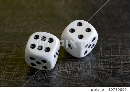 Two white dice gamble on a background 10730896