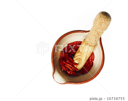 Studio shot of Mortar and Pestle with Red Chili Peppers on white background 10738755