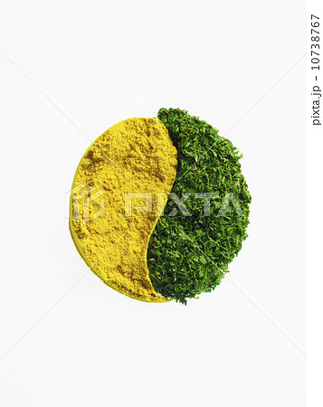 Studio shot of Mustard Powder making Yin and Yang sign on white background 10738767