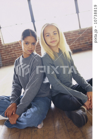 Friends sitting cross legged 10738819