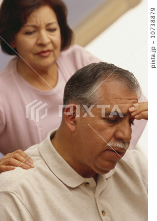 Woman comforting a man with a headache Woman comforting a man with a headache 10738879