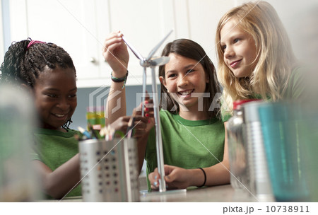 Group of children looking at model windmill 10738911