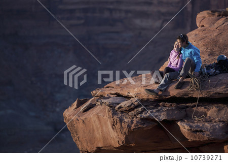 Hikers at top of cliff 10739271