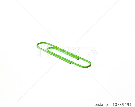 Green paper clip on white background Green paper clip on white background 10739494