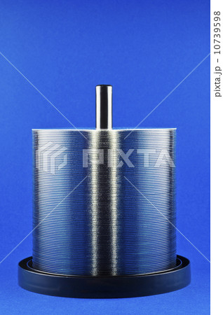 Studio shot of stack of CDs on spindle 10739598