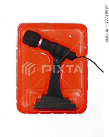 New microphone still in case on red background New microphone still in case on red background 10739997