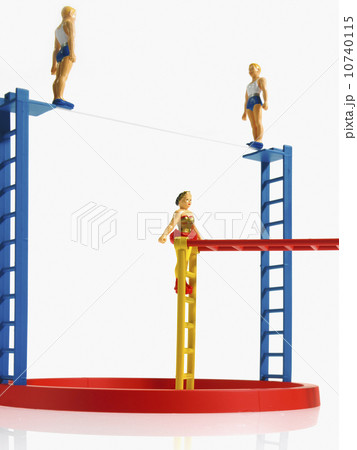 Studio shot of figurines on ladders Studio shot of figurines on ladders 10740115