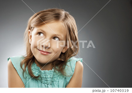 Studio portrait of girl (10-11) smiling 10740319
