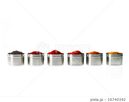 Studio shot of row of jars with spices Studio shot of row of jars with spices 10740392