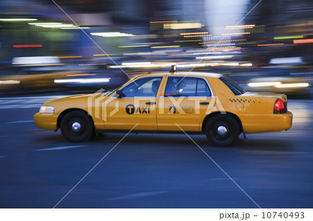 Taxi cab driving in the evening Taxi cab driving in the evening 10740493