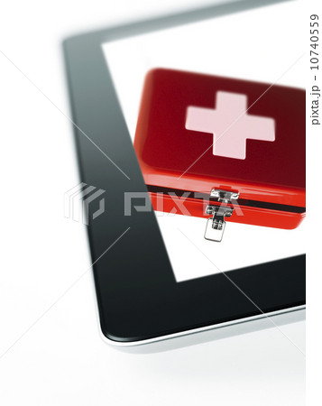 Studio shot of first aid kit on digital tablet Studio shot of first aid kit on digital tablet 10740559