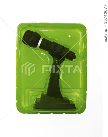 New wireless microphone still in case on red background New wireless microphone still in case on red background 10740677