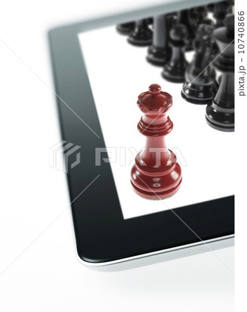 Studio shot of red chess queen and black chess pawns on tablet Studio shot of red chess queen and black chess pawns on tablet 10740866