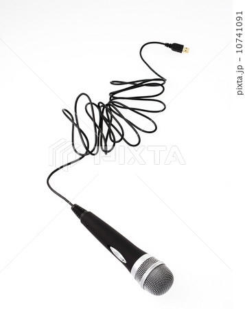 Studio shot of microphone and microphone cable on white background Studio shot of microphone and microphone cable on white background 10741091