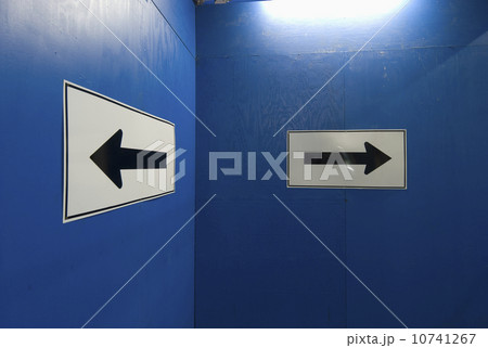 Arrow signs on blue wall Arrow signs on blue wall 10741267