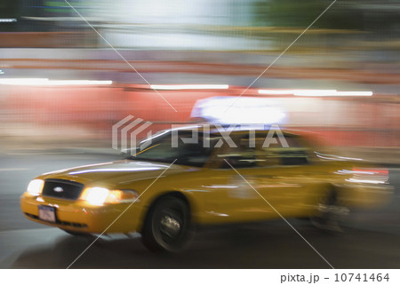 Taxi cab driving at night Taxi cab driving at night 10741464