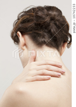 Rear view of beautiful young woman, studio shot Rear view of beautiful young woman, studio shot 10742233