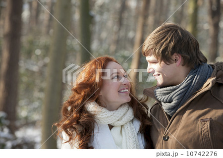 Young couple embracing in winter scenery Young couple embracing in winter scenery 10742276