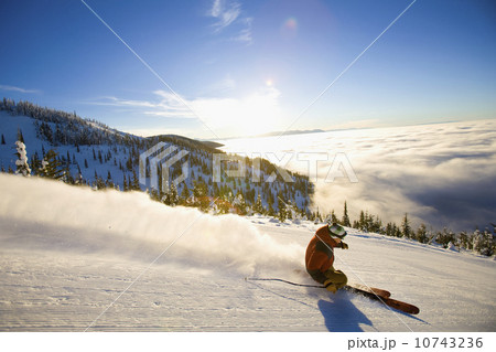USA, Montana, Whitefish, Male skier on mountain slope at sunrise 10743236