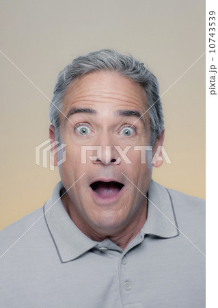 Studio Portrait of mature man looking surprised 10743539