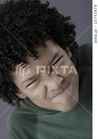 Portrait of boy (8-9) looking angry, studio shot 10743879