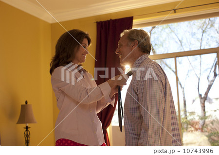 Woman helping man get dressed Woman helping man get dressed 10743996