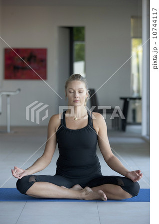 Mature woman practicing yoga Mature woman practicing yoga 10744117