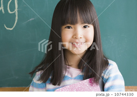 Portrait of girl (6-7) in classroom Portrait of girl (6-7) in classroom 10744330