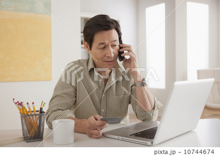 Man shopping online from home 10744674