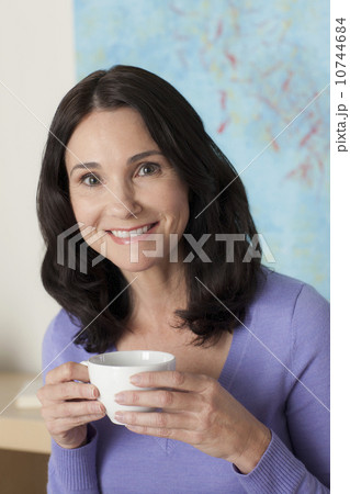 Portrait of mature woman drinking tea Portrait of mature woman drinking tea 10744684