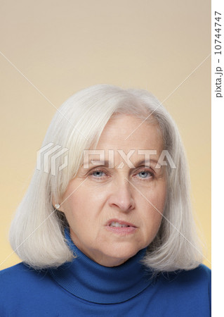 Studio shot of displeased senior woman 10744747