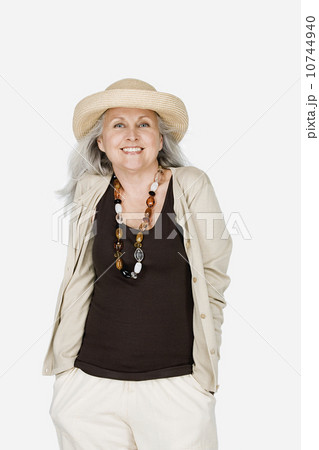 Studio portrait of mature woman wearing hat 10744940