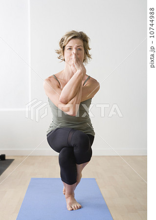 Woman in yoga pose Woman in yoga pose 10744988