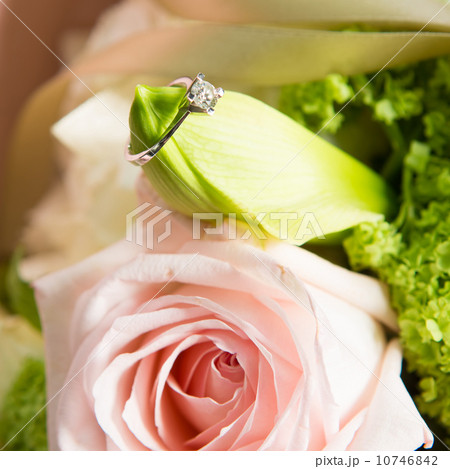 wedding ring and beautiful flowers. 10746842
