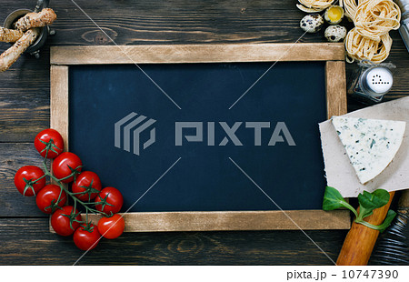 Italian food on vintage wood background with chalkboard Italian food on vintage wood background with chalkboard 10747390