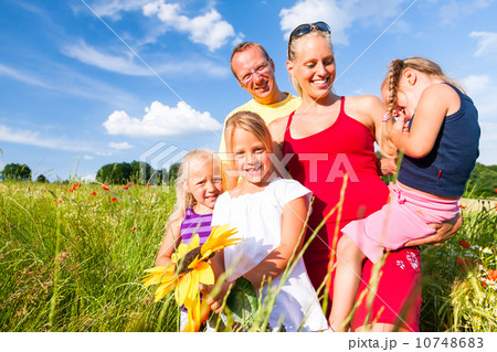 Family in grass in summer Family in grass in summer 10748683