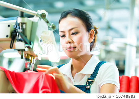 Seamstress in a chinese textile factory Seamstress in a chinese textile factory 10748883