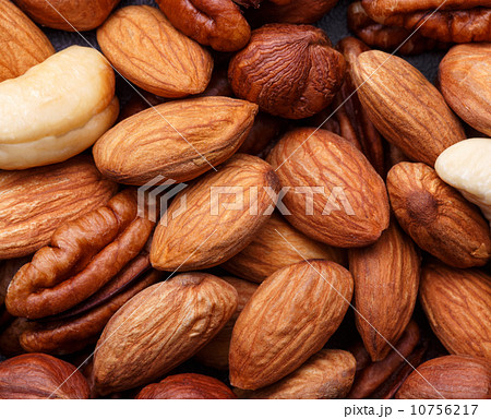 Background texture of assorted mixed nuts including cashew, peca Background texture of assorted mixed nuts including cashew, peca 10756217