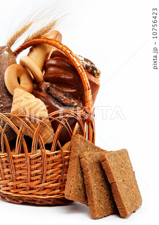 large variety of bread, still life isolate on a wooden table ove 10756423