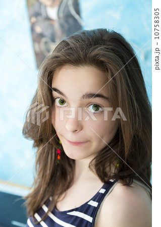 beautiful teenage girl looking caught into the camera 10758305