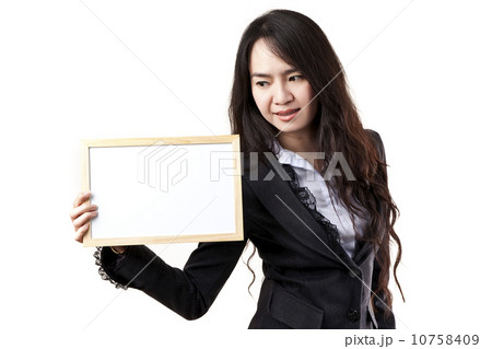 Business woman holding a blank white board Business woman holding a blank white board 10758409